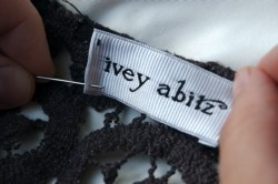 Ivey Abitz label being sewn