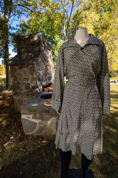 Baedeker Dress in Dignity Cottage Weave; Pierrepont Breeches-Leggings in Liberty Washed Stretch Twill; Chittister Duster Coat in Liberty Pin Tuck Twill (draped on stone fireplace). Location: Stone grill where Eleanor would serve hotdogs to dignitaries (she served hotdogs to King George of England up the hill from this location), family, and friends. Eleanor Roosevelt National Historic Site. Val-Kill, Hyde Park, New York.