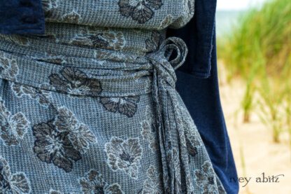 Eugenia Jacket in Seascape Melange Knit; Tilbrook Frock in Seascape Floral Linen; Porte Cochere Sash in Seascape Floral Linen. Ivey Abitz Bespoke Clothing.